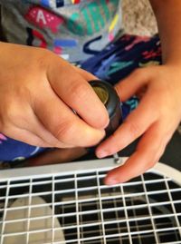 Close-up of hands playing guitar