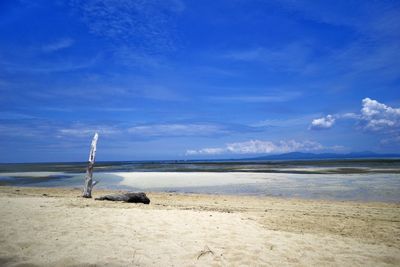Scenic view of sea against blue sky