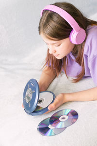 Side view of girl playing with toy