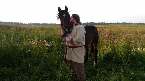 Friends standing in a field