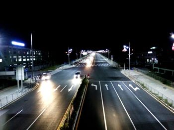 High angle view of light trails on road at night