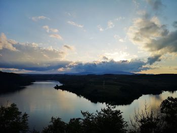 Scenic view of lake against sky during sunset