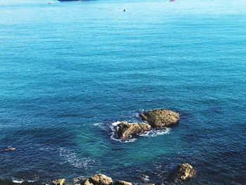 High angle view of rocks in sea