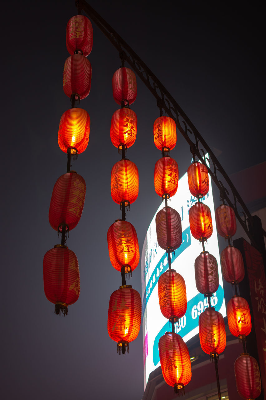 LOW ANGLE VIEW OF LANTERN HANGING AGAINST SKY