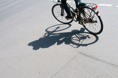 Shadow of person on bicycle