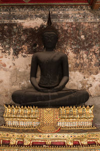 Statue against temple