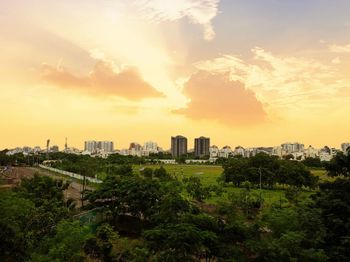 High angle view of buildings against sky during sunset