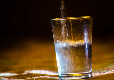 Close-up of beer glass on table