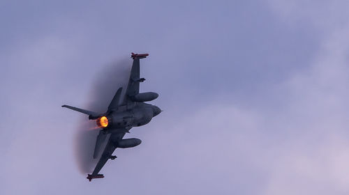 Low angle view of airplane against sky