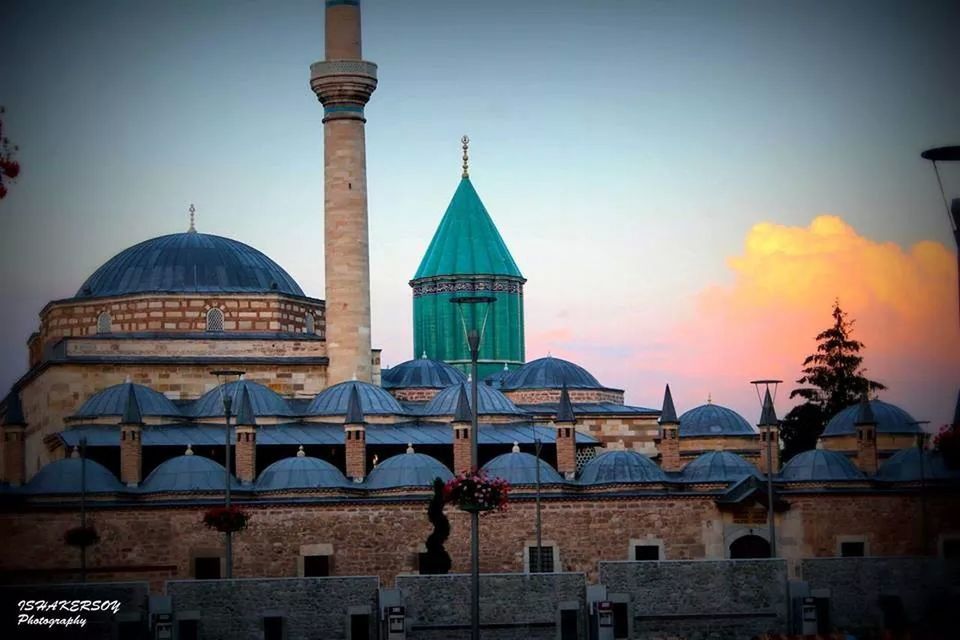 architecture, building exterior, built structure, low angle view, dome, religion, place of worship, sky, spirituality, church, high section, sunset, window, outdoors, no people, clear sky, orange color, illuminated, building