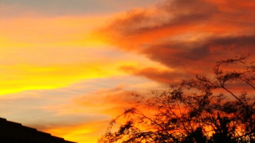 Low angle view of cloudy sky at sunset