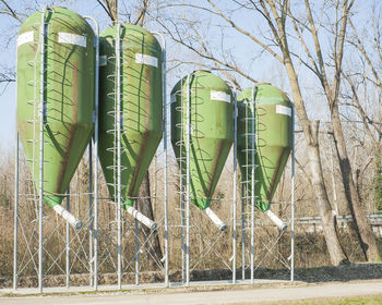 Storage tanks against sky at factory