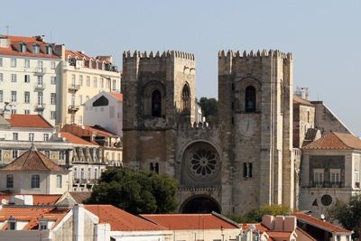 Lisbon cathedral amidst buildings