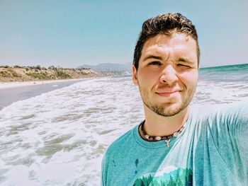 Portrait of young man on beach