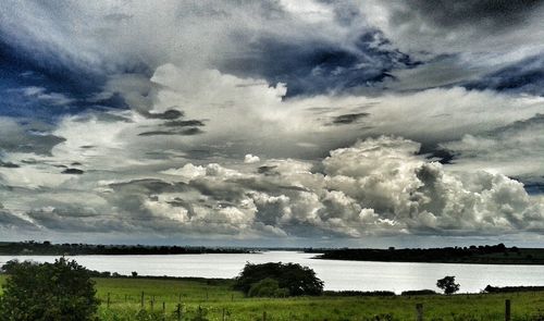 Scenic view of landscape against cloudy sky