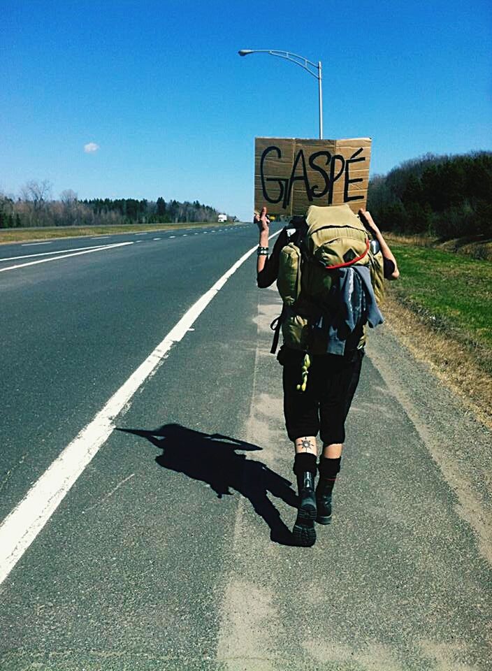 FULL LENGTH REAR VIEW OF A MAN ON ROAD