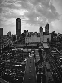 Cityscape against cloudy sky