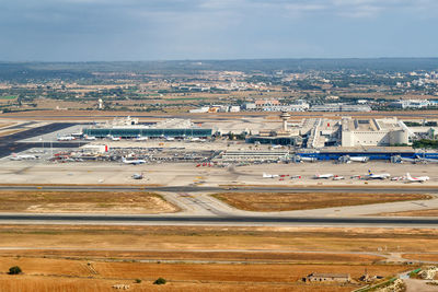 High angle view of road amidst buildings against sky