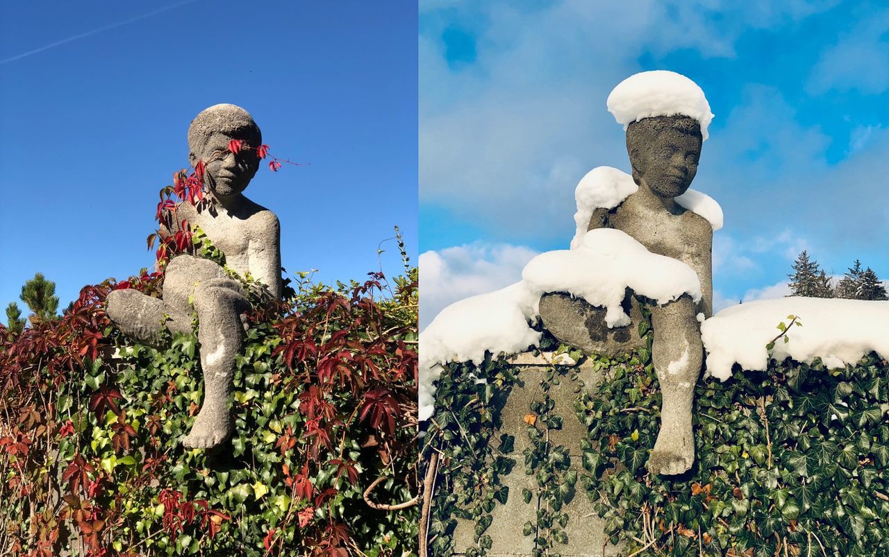 STATUE AGAINST BLUE SKY