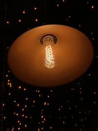 Low angle view of illuminated light bulb