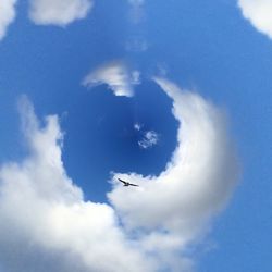 Low angle view of airplane flying in sky