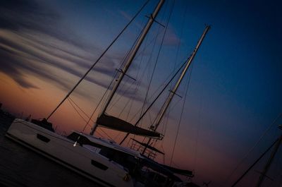 Low angle view of sailboat in sea against sky