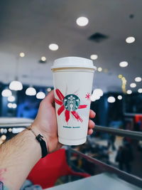 Close-up of hand holding drink