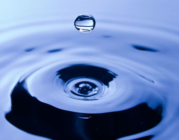High angle view of drop falling on water