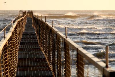 Pier over sea against sky