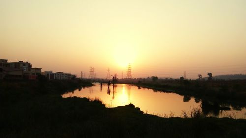 Silhouette of city during sunset