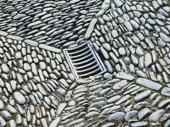 High angle view of drain on road