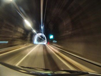 Blurred motion of car on road in tunnel