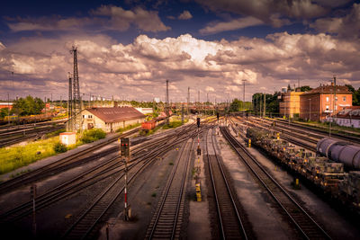 High angle view of train at railroad station against sky