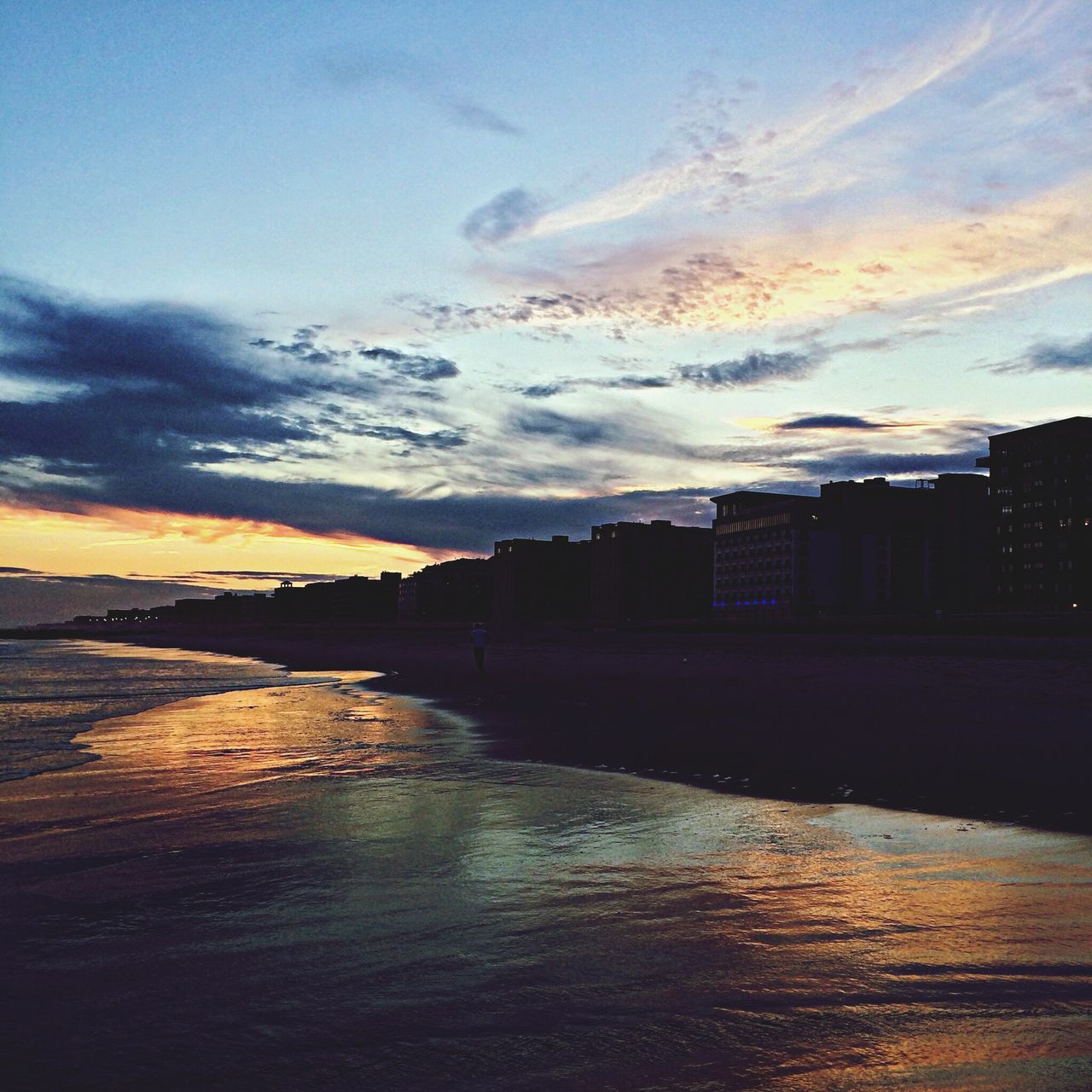 sunset, sky, water, architecture, built structure, building exterior, cloud - sky, sea, city, scenics, beauty in nature, cloud, nature, river, waterfront, tranquil scene, orange color, tranquility, dusk, cloudy