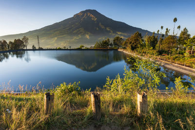 Scenic view of lake and mountains against sky