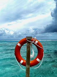 Container ship on sea against sky