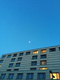 Low angle view of building against blue sky