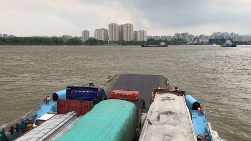 Panoramic view of river and city against sky