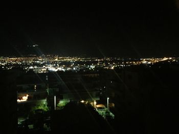 Illuminated cityscape at night