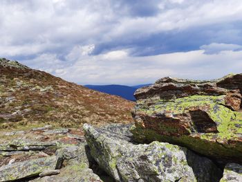 Rock formations on landscape against sky