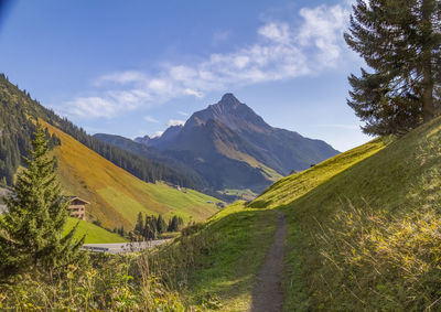 Scenic view of landscape and mountains against sky