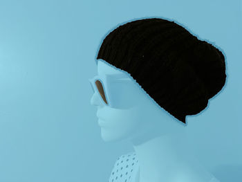 Close-up of hat against blue background