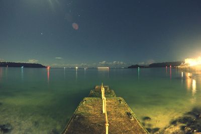 Scenic view of sea against sky at dusk