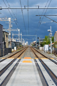 Train railway track with power cables in the local railway station in japan.