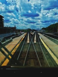 Train on railroad tracks against sky