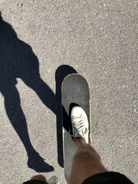 Low section of person standing on street