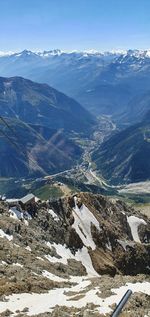 High angle view of snowcapped mountains against sky