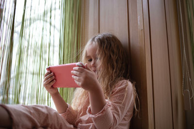 Young woman using mobile phone