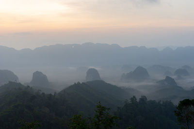 Scenic view of mountains against sky during sunset