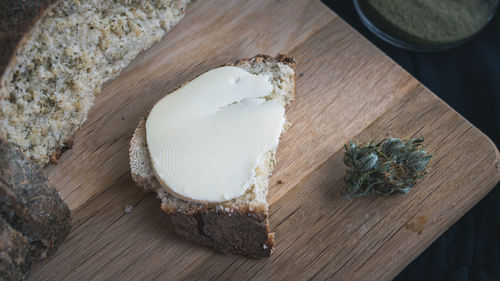 High angle view of bread on cutting board